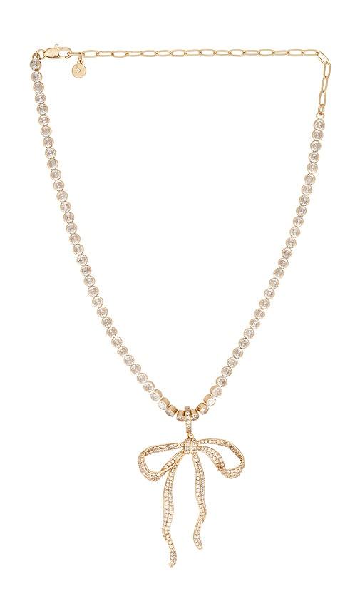ettika pave bow tennis necklace in metallic gold.
