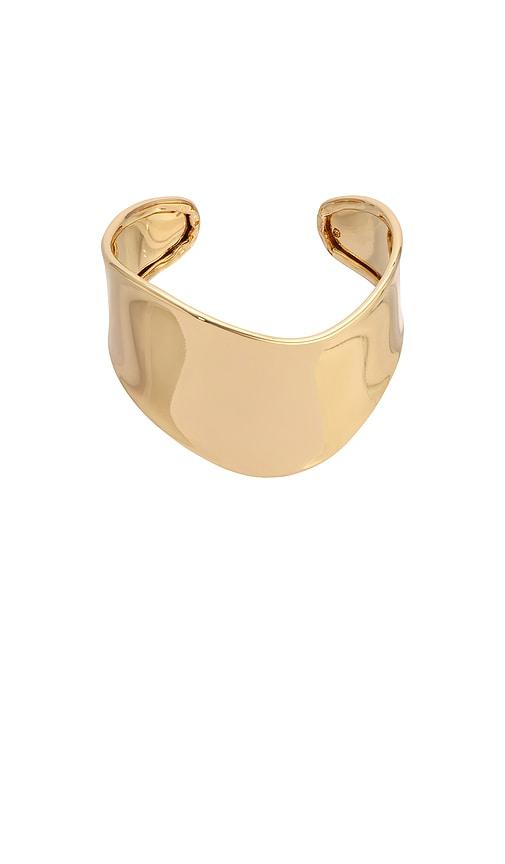 ettika smooth cuff bracelet in metallic gold.