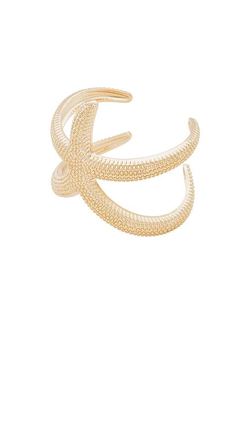 ettika starfish bracelet in metallic gold.