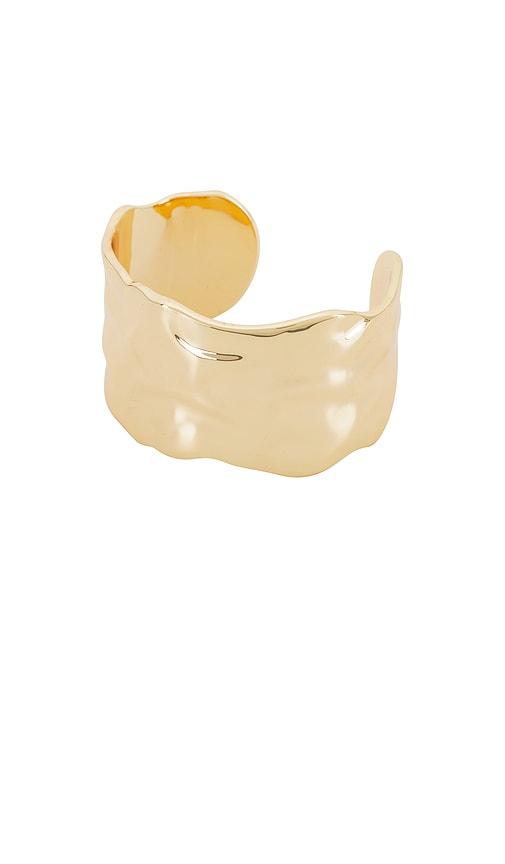 ettika thick sculpted cuff in metallic gold.