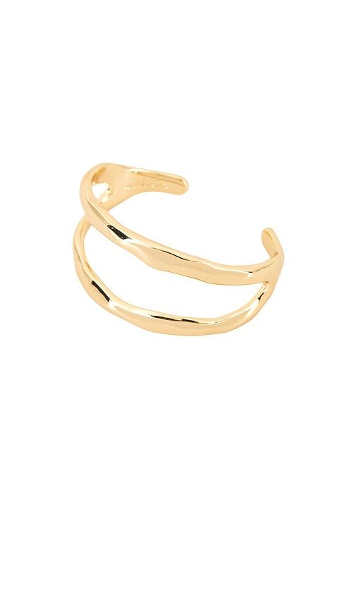 ettika tide pool double open cuff in metallic gold.
