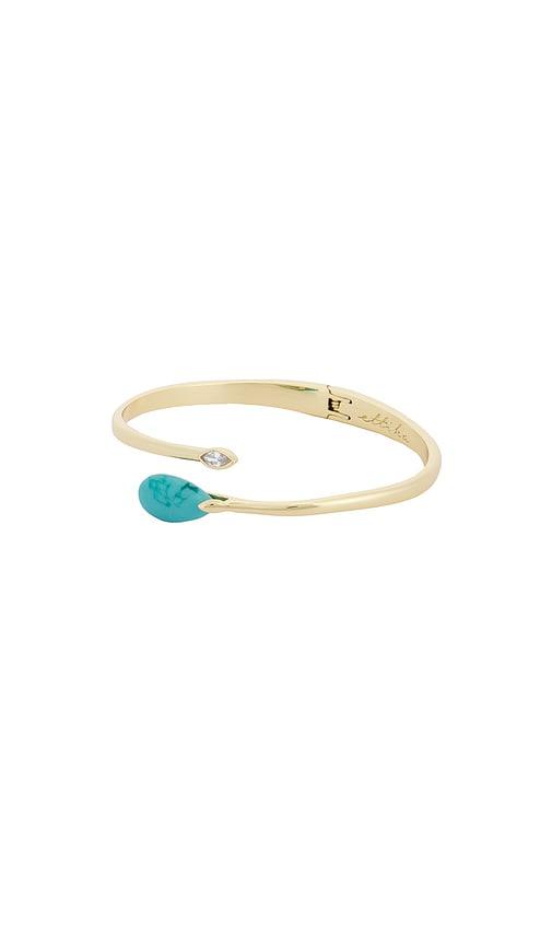ettika turquoise teardrop cuff in metallic gold.