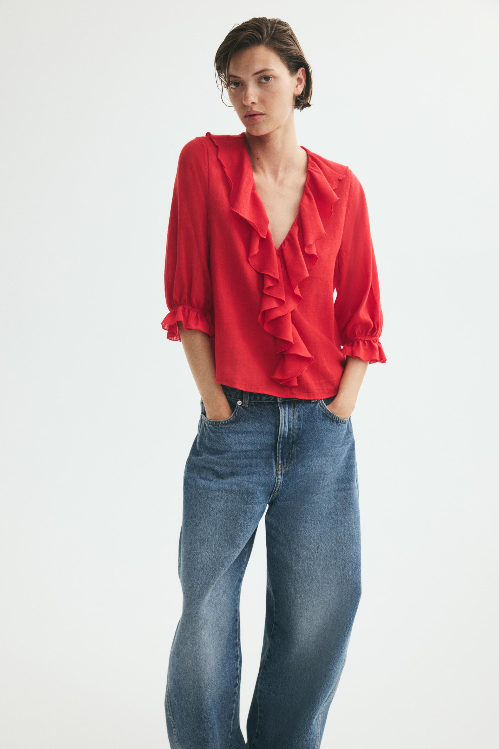 flounced cotton-blend blouse