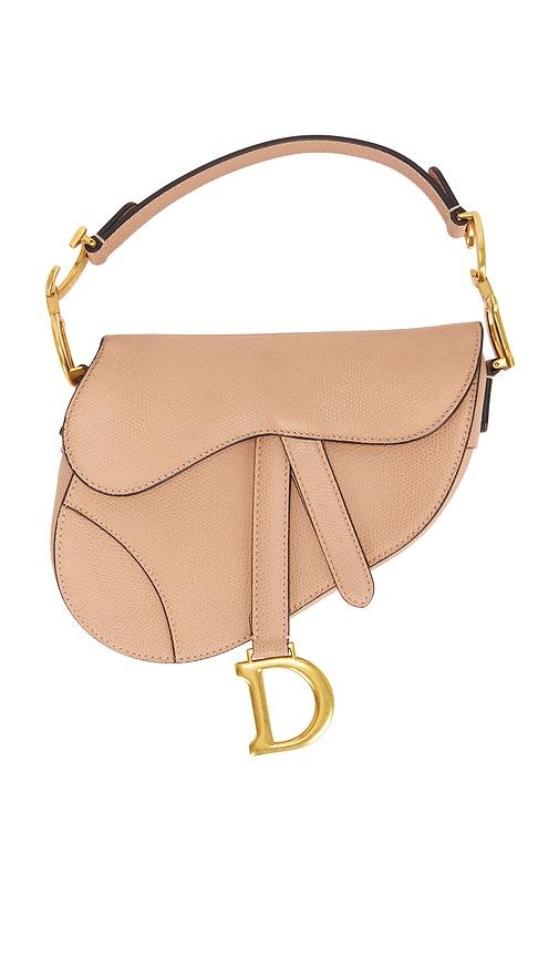 fwrd renew dior mini saddle bag in nude.