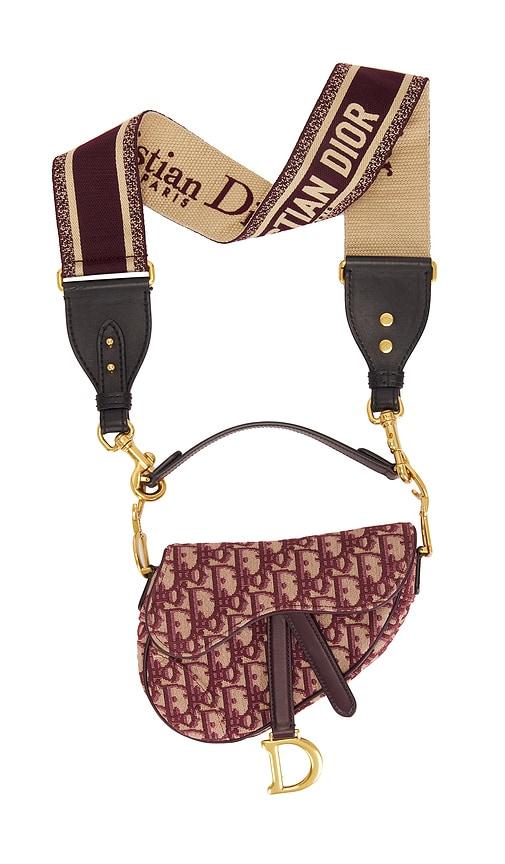 fwrd renew dior oblique mini saddle bag in red.