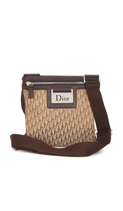 fwrd renew dior street chic messenger bag in beige.
