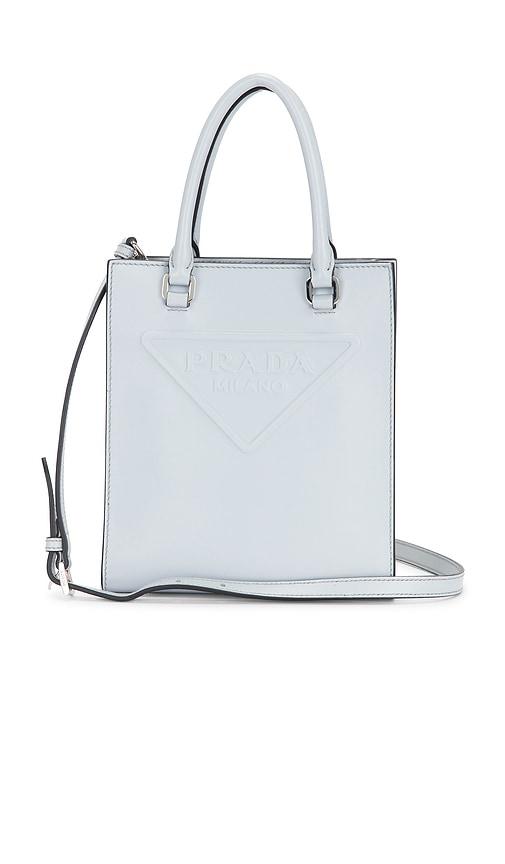 fwrd renew prada mini drill tote bag in white.
