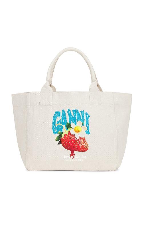 ganni medium trapeze shopper strawberry print in cream.