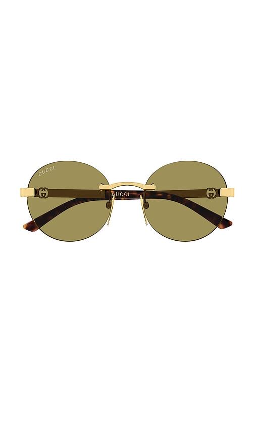 gucci round sunglasses in metallic gold.