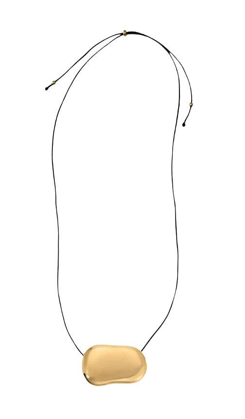 heaven mayhem julia long pendant necklace in metallic gold.