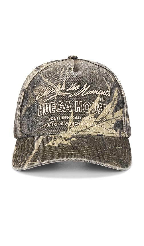 huega house moments hat in green.