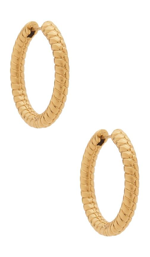jennifer fisher madison huggie earrings in metallic gold.