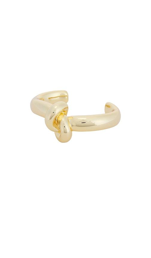 jennifer fisher thin knot cuff in metallic gold.