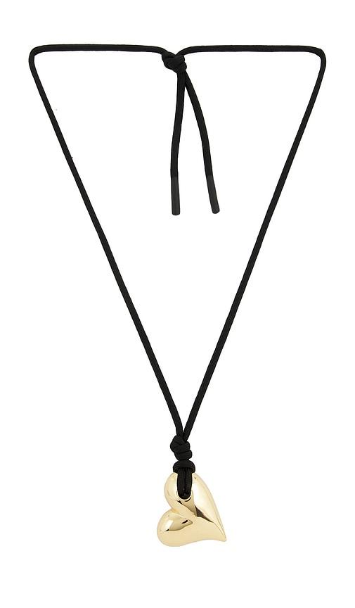 jenny bird art heart on a string necklace in metallic gold.