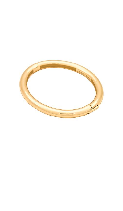 jenny bird gia bangle in metallic gold.