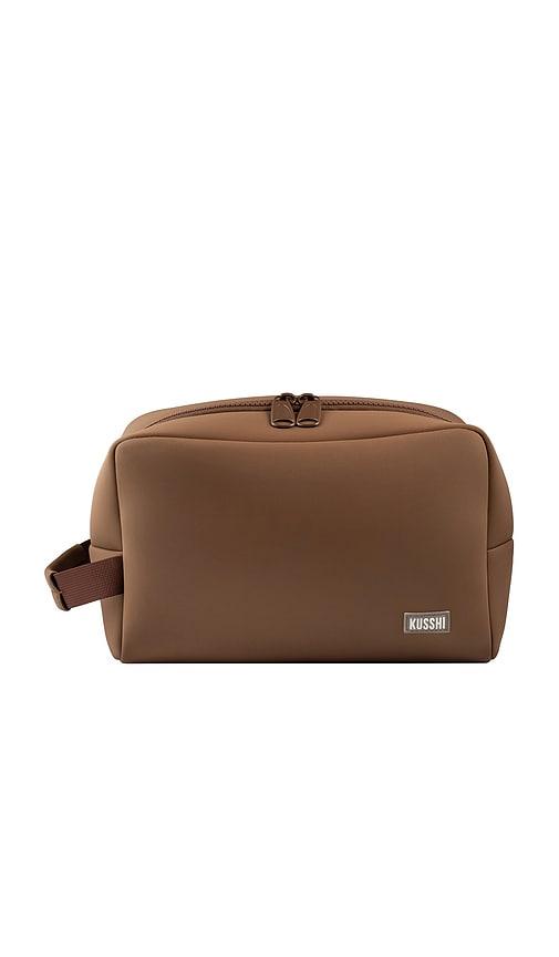 kusshi neoprene dopp kit in chocolate & pearl blue.