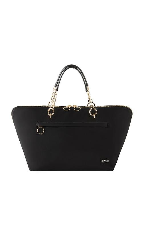 kusshi the traveler bag in black & pink.
