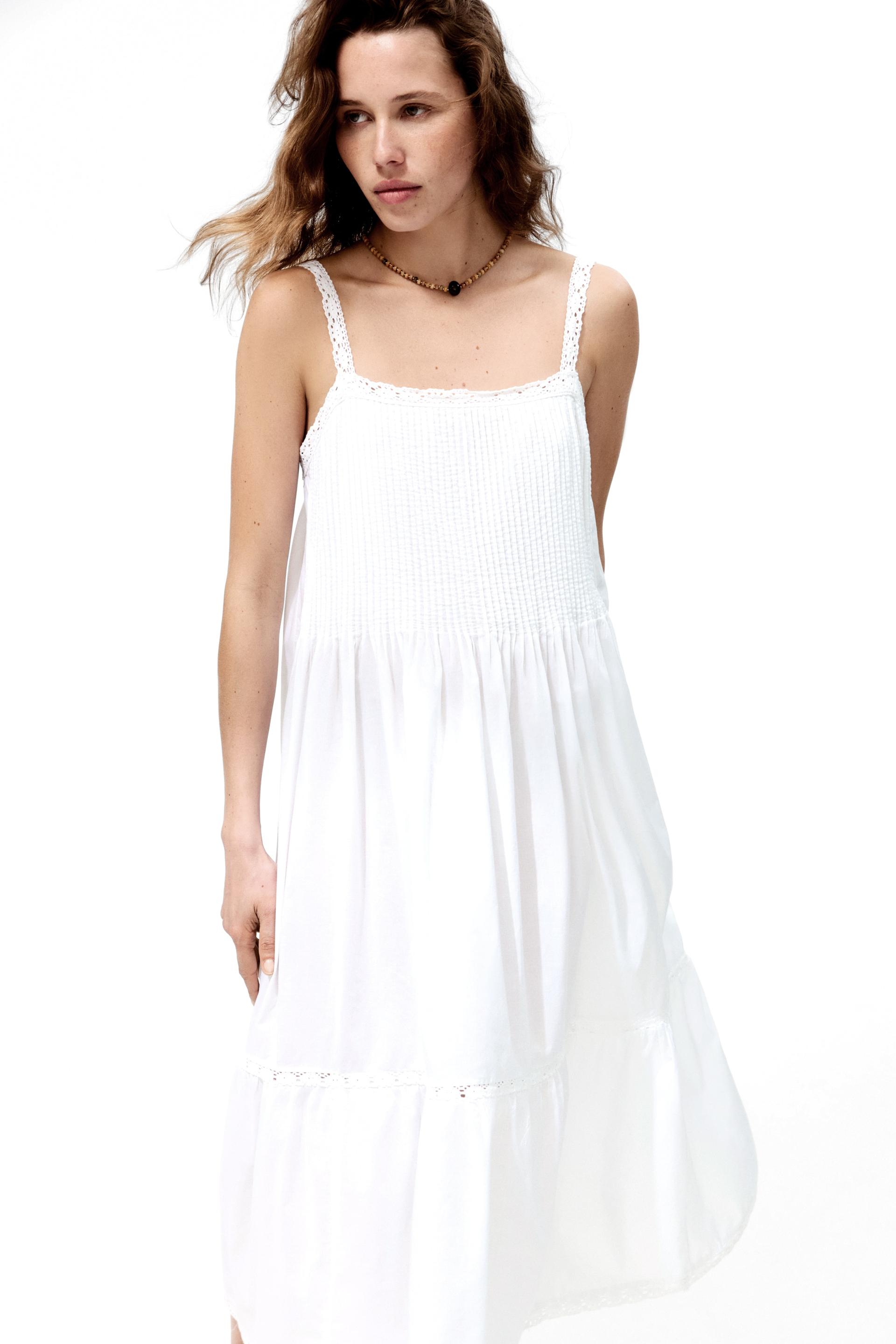 lace-trimmed dress with flared skirt