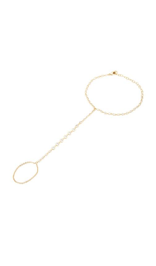 lili claspe cici hand chain in metallic gold.