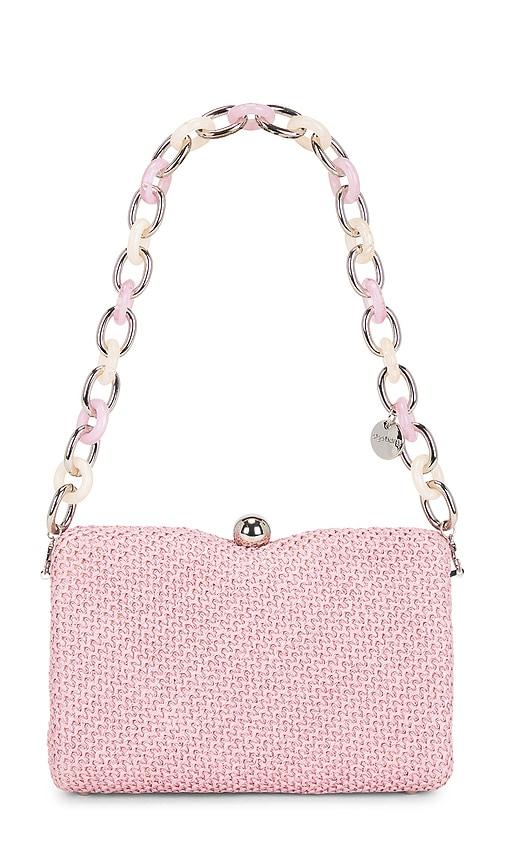 olga berg birdie textural top handle bag in pink.