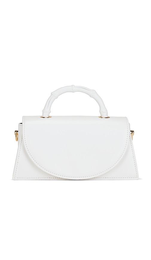 olga berg phoebe bamboo handle bag in white.