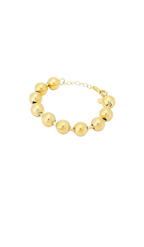 petit moments ball statement bracelet in metallic gold.