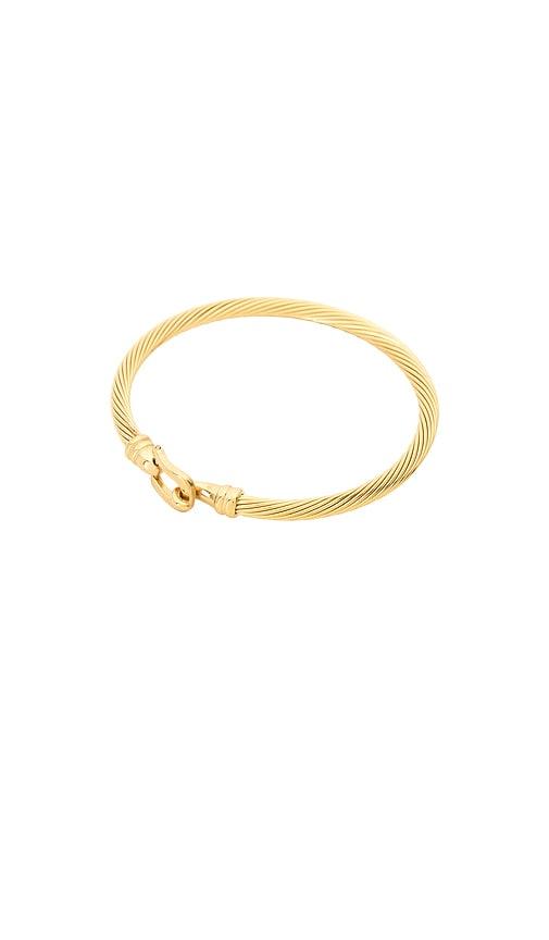 petit moments bit tension cuff in metallic gold.
