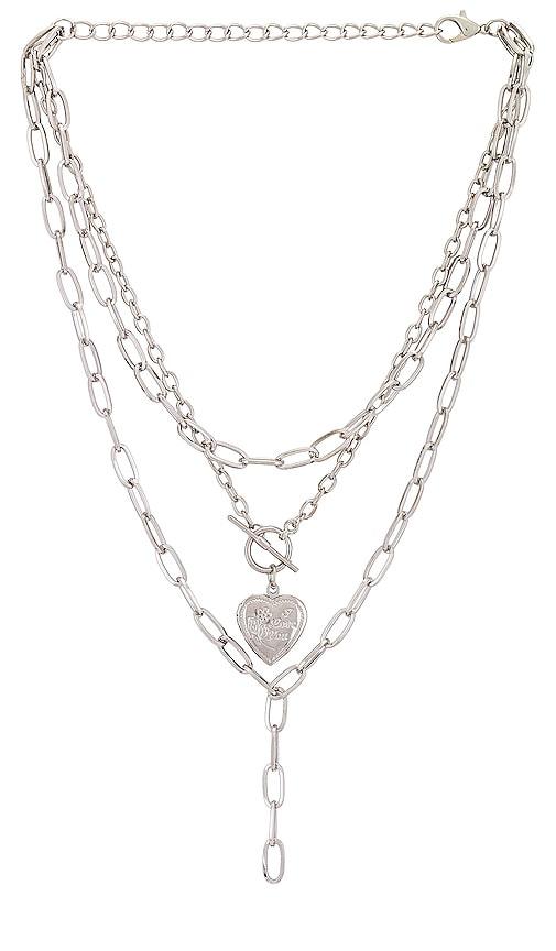 petit moments harp necklace in metallic silver.
