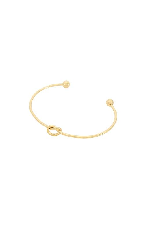 petit moments knot bracelet in metallic gold.