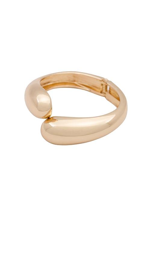 petit moments livorno cuff in metallic gold.
