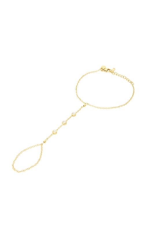 petit moments pavia hand chain in metallic gold.