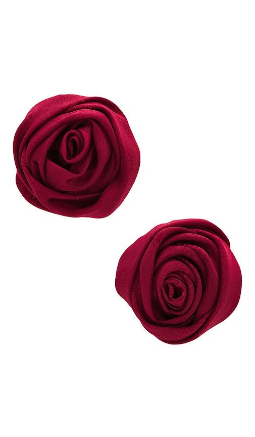 petit moments rosette studs in red.