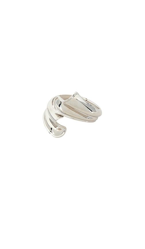 petit moments sculpture cuff in metallic silver.