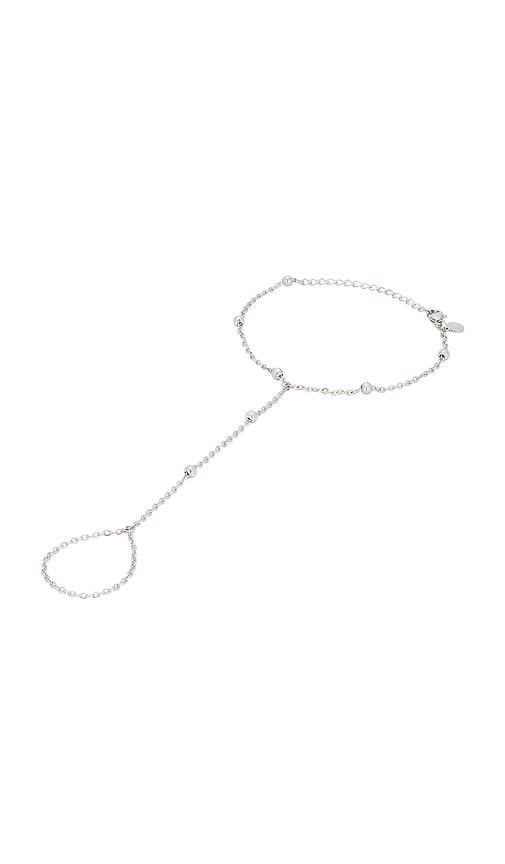 petit moments sol hand chain bracelet in metallic silver.