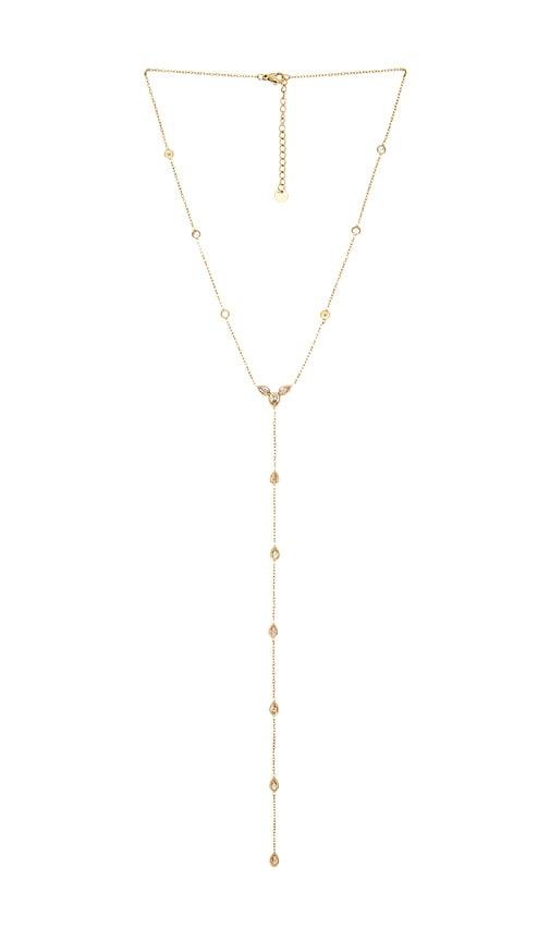 petit moments stone drop lariat in metallic gold.