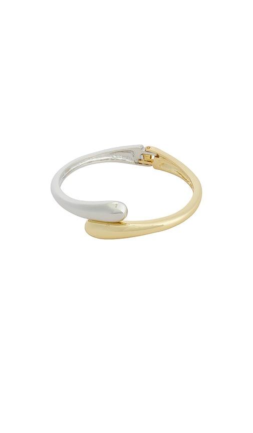 petit moments thin livorno cuff bracelet in metallic gold.