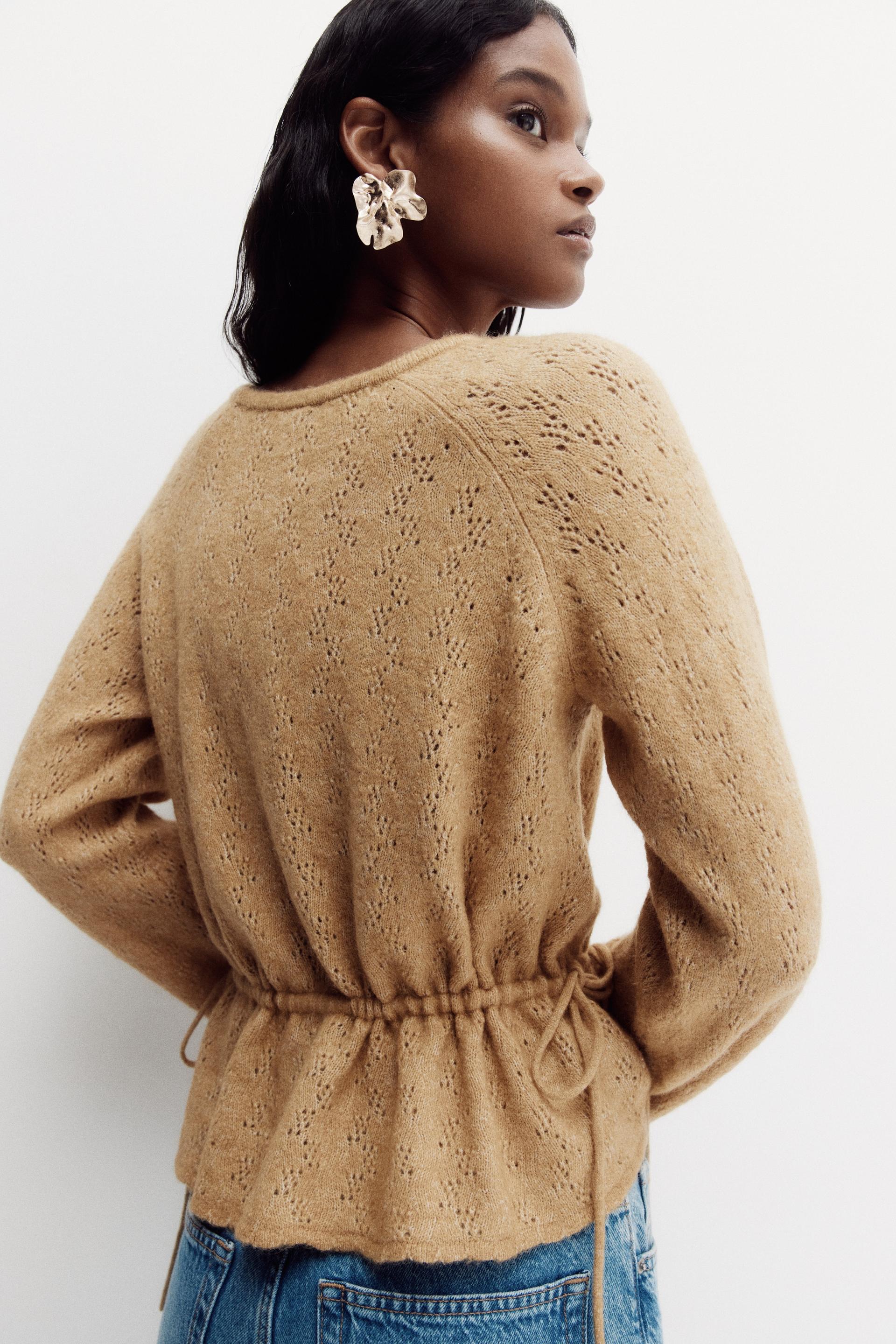 pointelle-knit peplum top