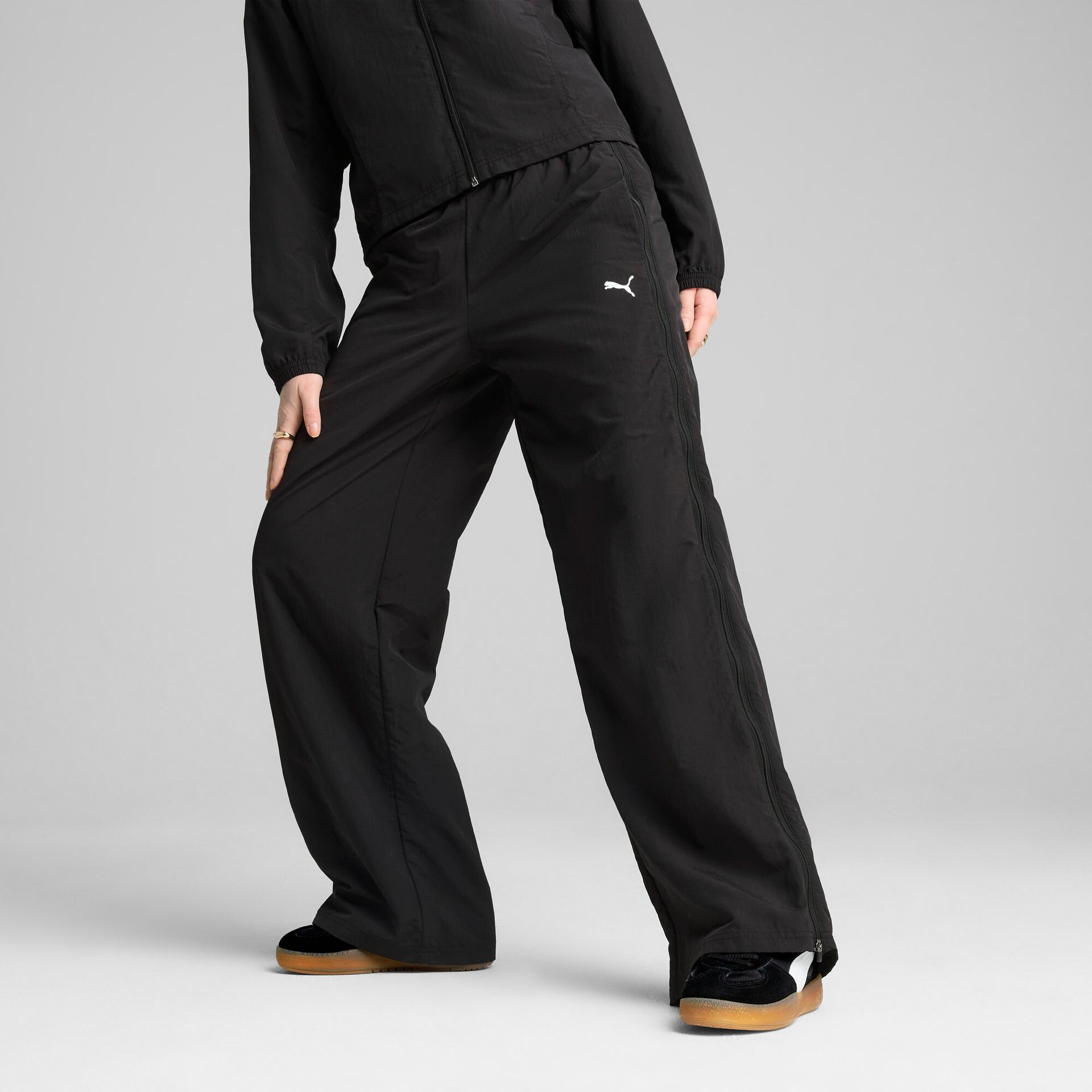 puma dare to women's relaxed woven zip-off pants in black, size m