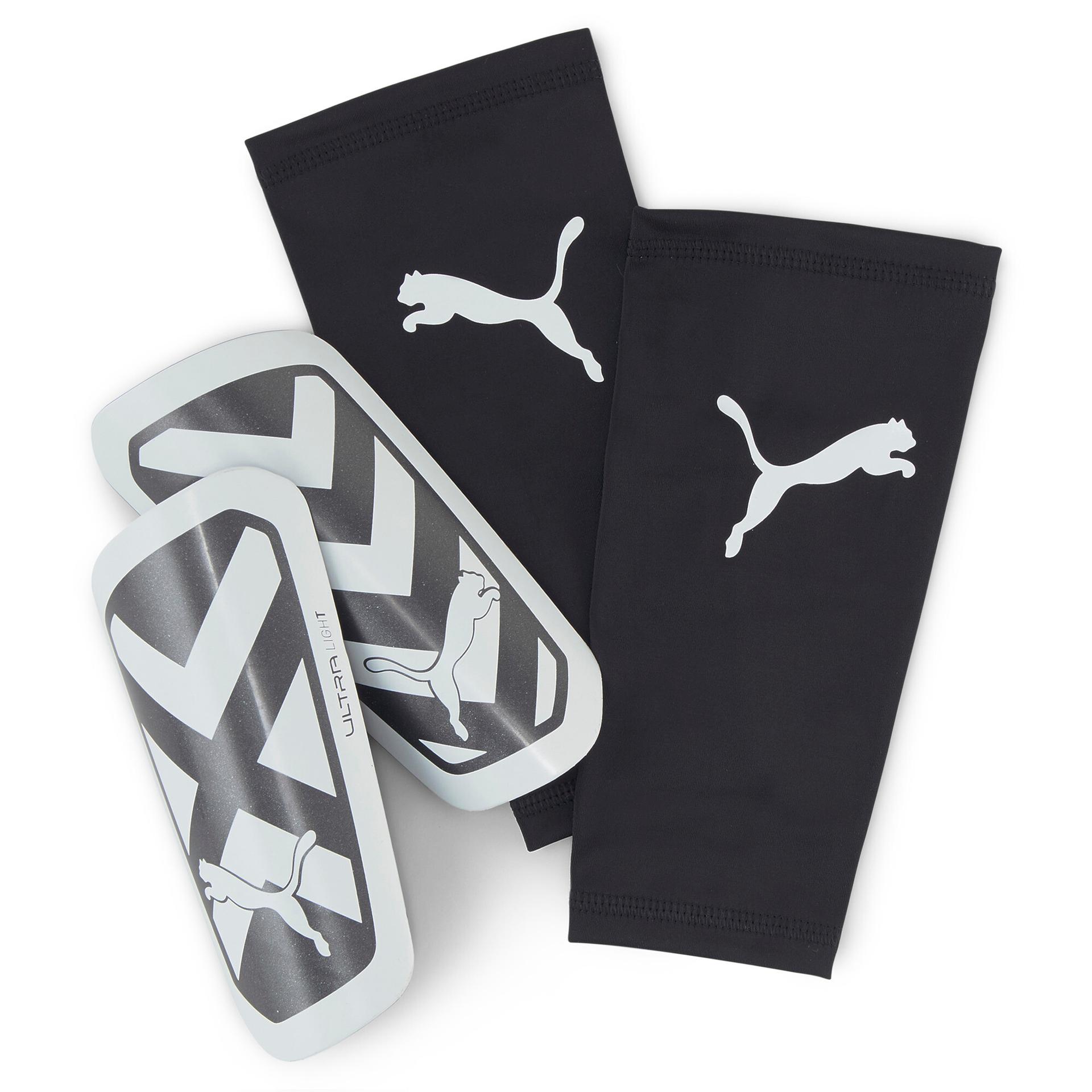 puma ultra light sleeve football shin guards in black, size l