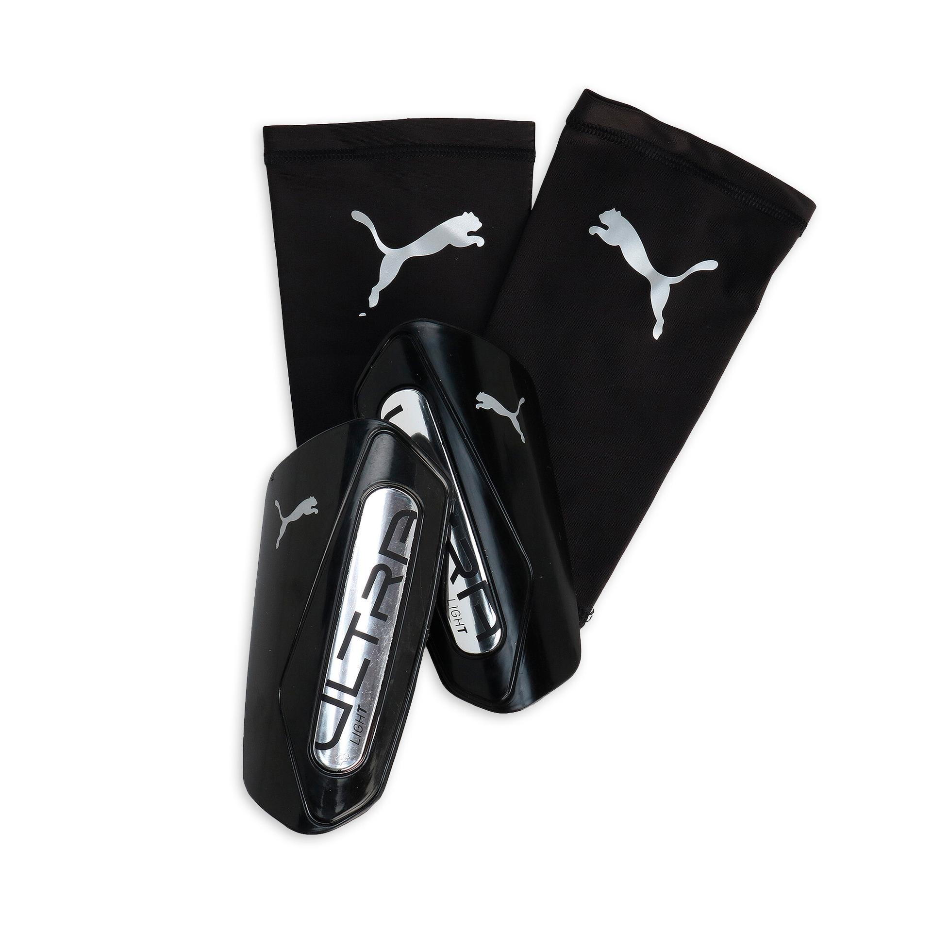 puma ultra light soccer sleeve shinguards in black, size m