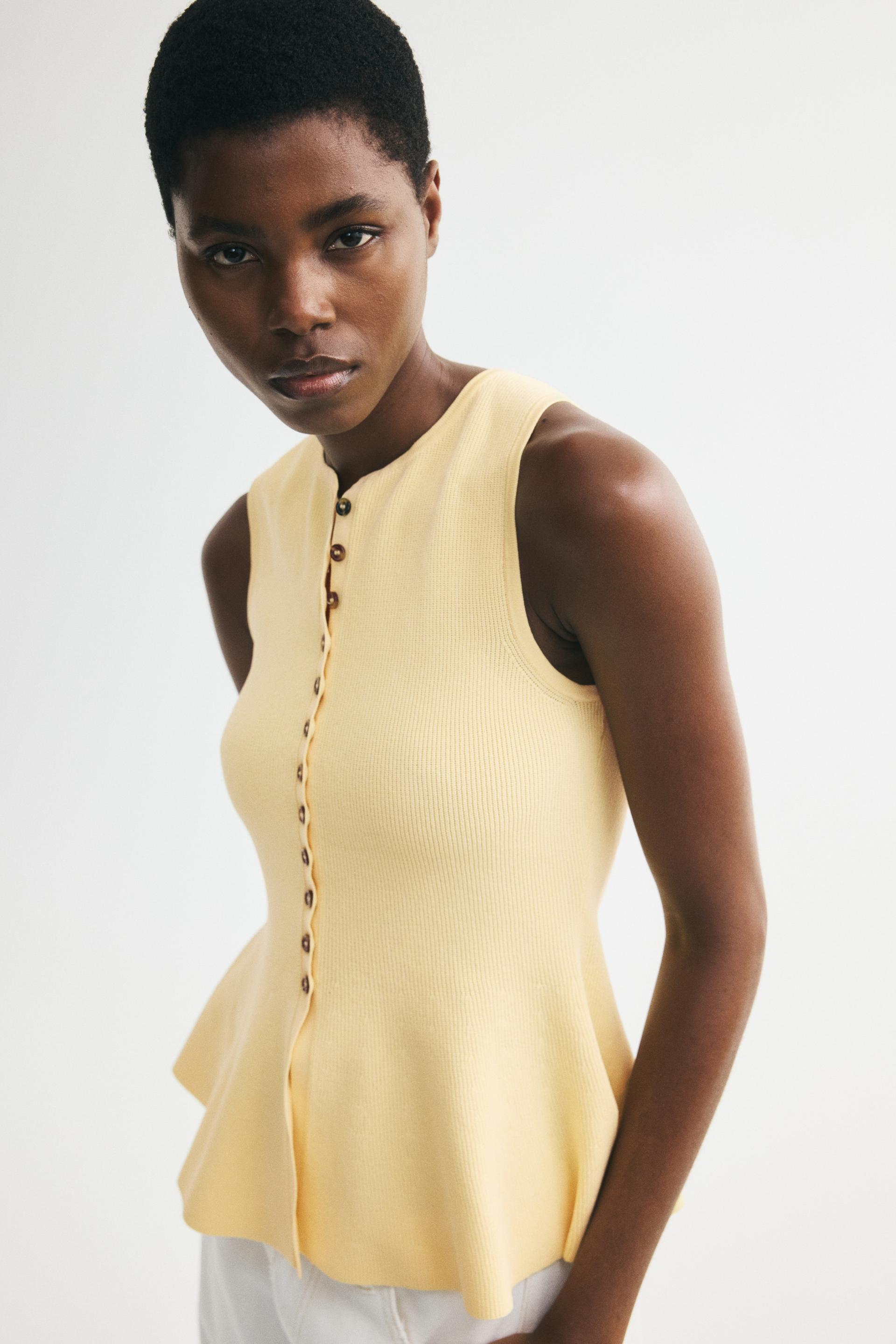 rib-knit peplum sleeveless top