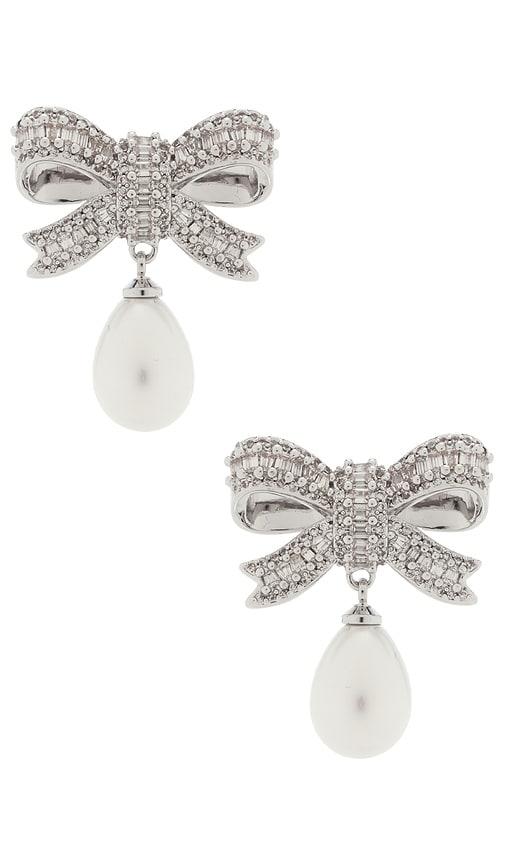 self-portrait crystal bow pearl droplet earrings in metallic silver.