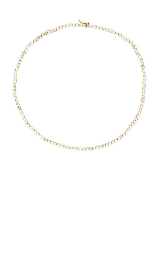 shashi bezel tennis necklace in metallic gold.