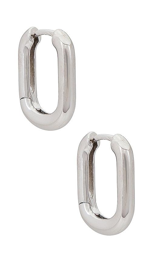 shashi cosmo huggie in metallic silver.