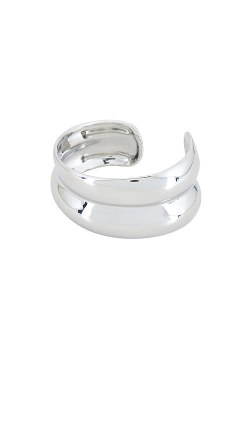 shashi double dome cuff bracelet in metallic silver.