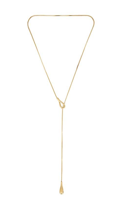 shashi elliot lariat necklace in metallic gold.