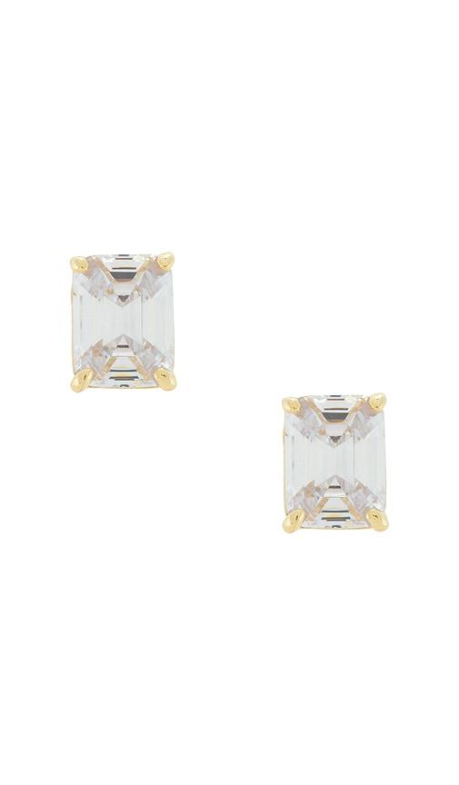 shashi emerald cut stud earrings in metallic gold.