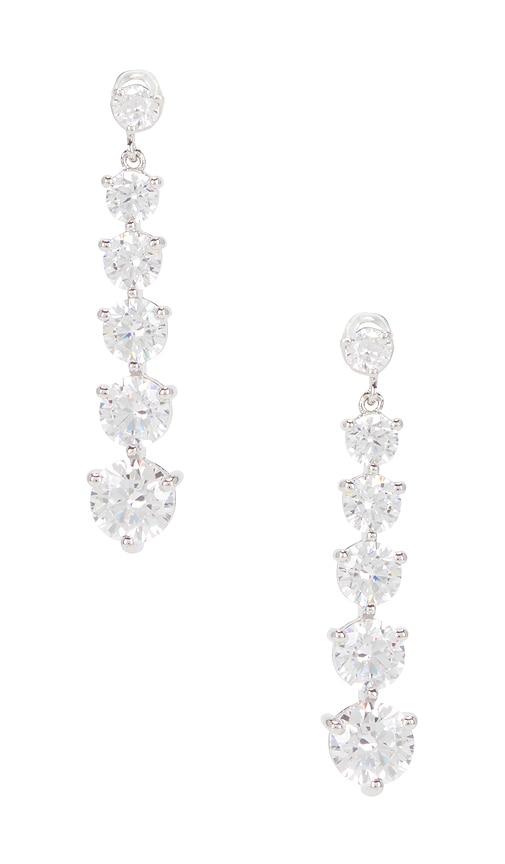shashi graduated tennis earring in metallic silver.
