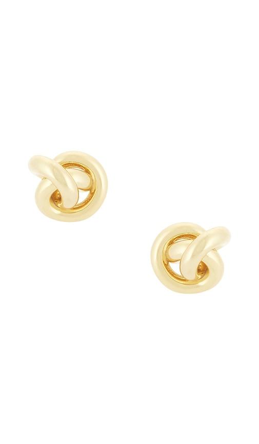 shashi knot stud earrings in metallic gold.