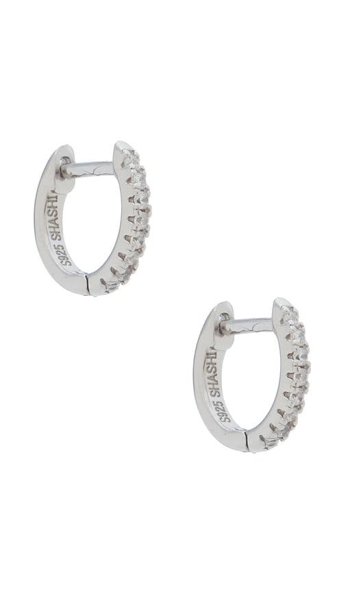shashi micro pave huggie earrings in metallic silver.